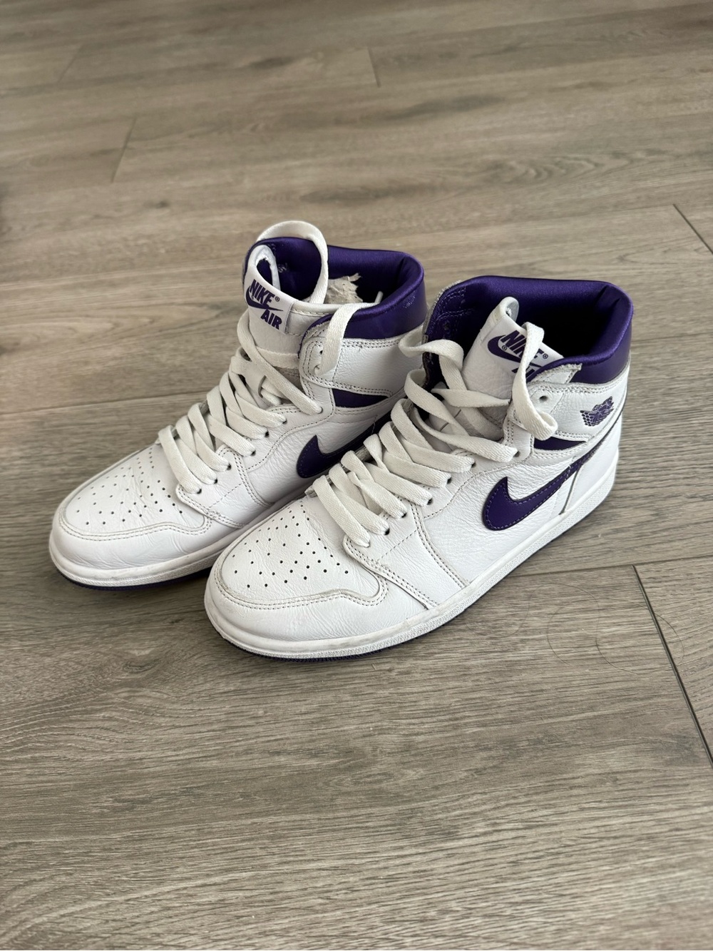 Nike Air Jordan 1 High Top Sneakers in White & Purple